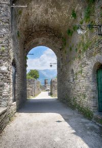 Archway of historic building against sky