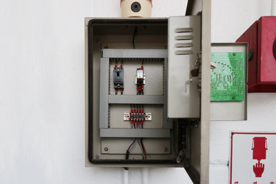 Close-up of telephone booth on wall