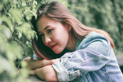 Portrait of young woman looking at camera