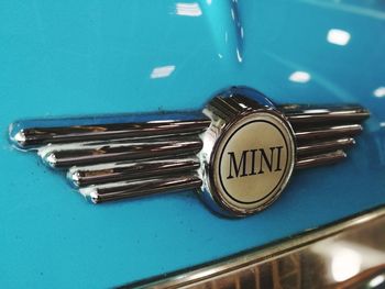 Close-up of blue metal container on table