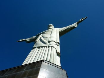 Low angle view of built structure against blue sky