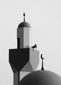 Bird perching on a building