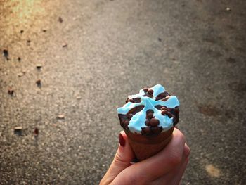 Midsection of person holding ice cream cone