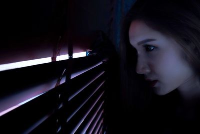 Side view of a young woman