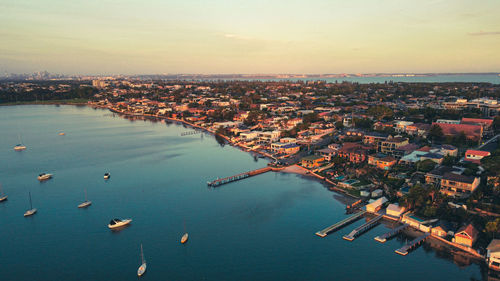 High angle view of townscape by sea