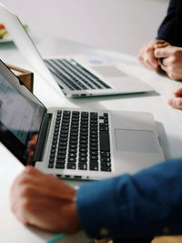 Surface level view of two men at office desk