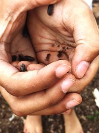 Close-up of man holding hands