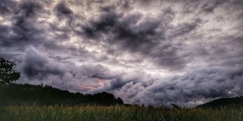 Scenic view of dramatic sky over land
