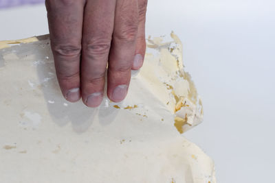 Close-up of hand holding ice cream