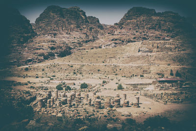 Aerial view of building and mountains against sky