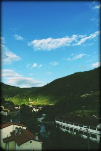 Scenic view of mountains against cloudy sky