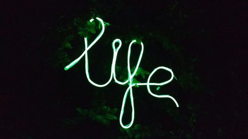 Close-up of light painting against black background