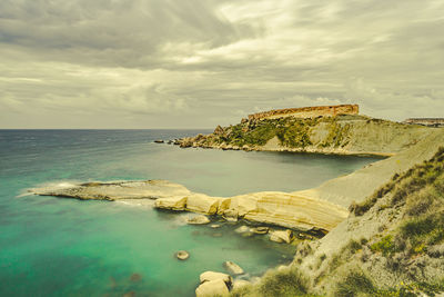 Scenic view of sea shore against sky