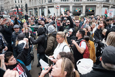 Group of people on street in city