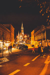 Illuminated street at night