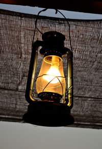 Low angle view of illuminated light bulb