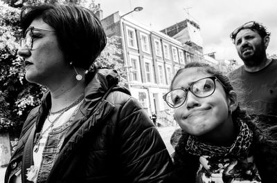 Portrait of young couple standing outdoors