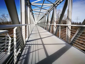 View of footbridge against clear sky