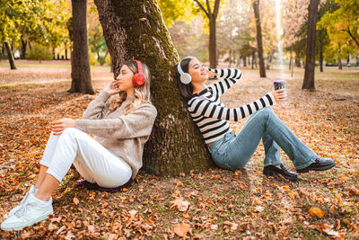 Friends sitting on field