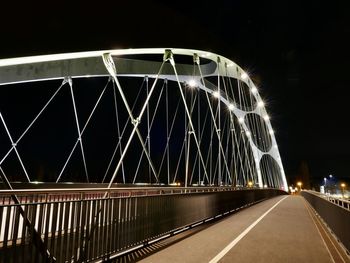 View of bridge in city at night