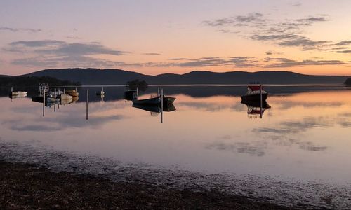 Scenic view of lake against sky during sunset