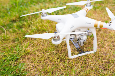 High angle view of airplane flying over field