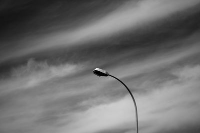 Low angle view of street light against sky