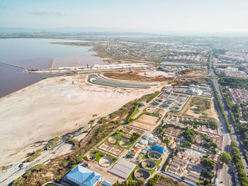 High angle view of river amidst buildings in city