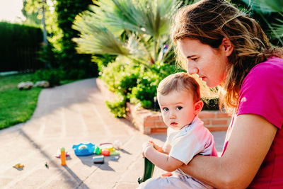 Mother and girl and daughter outdoors