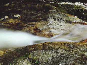 Close-up of water flowing through rocks