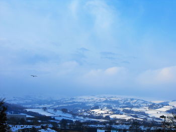 Aerial view of cityscape against sky