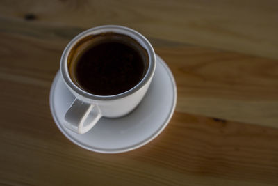 High angle view of black coffee on table