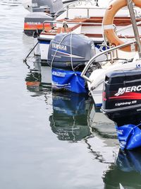 Boats moored in lake