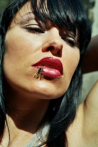 Close-up of young woman smoking