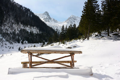 Scenic view of snow covered mountains against sky