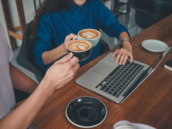 High angle view of coffee cup on table