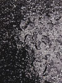 Full frame shot of raindrops on snow