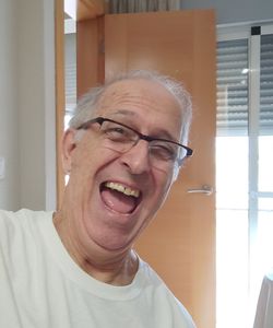 Portrait of smiling young man at home