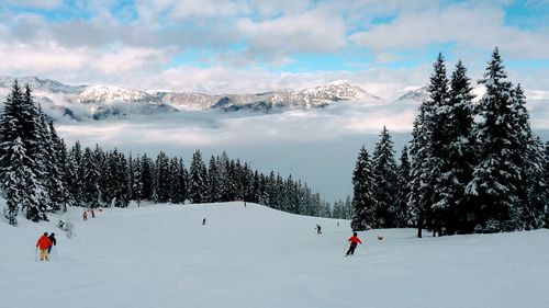 Scenic view of snowcapped mountains against sky