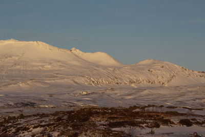 Scenic view of snowcapped mountains against sky