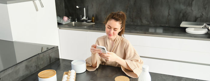 Young woman using mobile phone