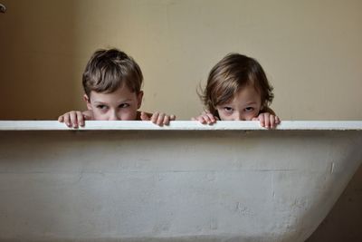 Brothers in bathtub at home