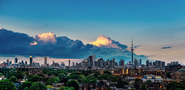 Panoramic view of city against sky during sunset