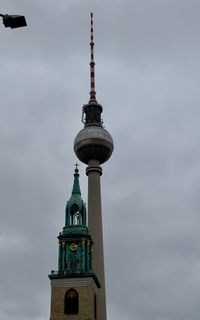 Low angle view of building against cloudy sky