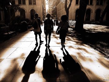 Shadow of people on street