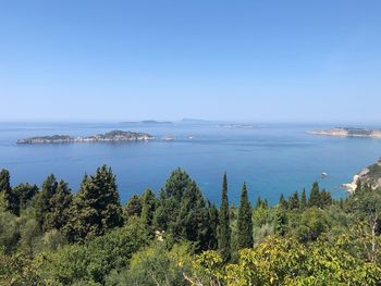 Scenic view of sea against clear blue sky