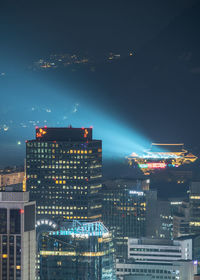 Illuminated buildings in city at night