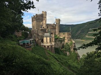 View of castle against cloudy sky