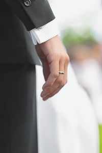 Midsection of bridegroom standing