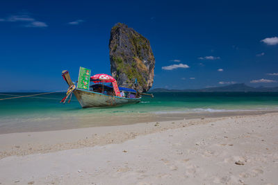 Boat on beach against sky